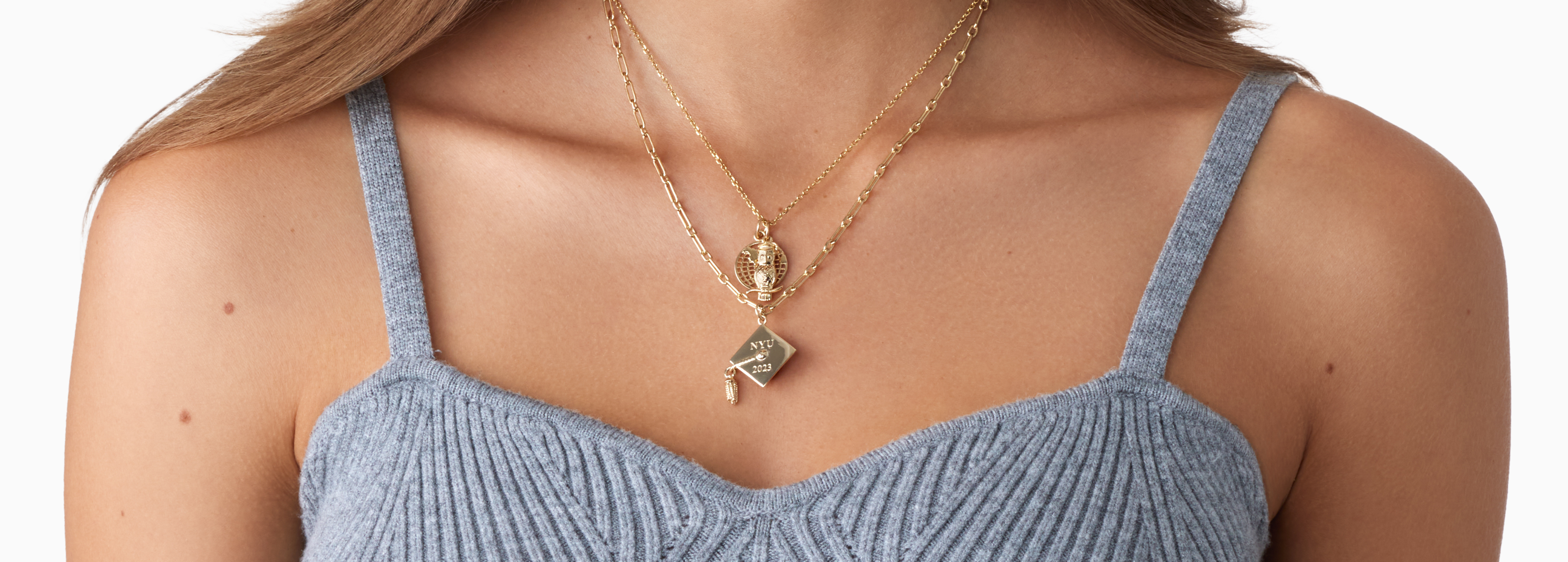 graduate wearing new gifted charm necklace
